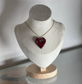 Collier coeur bordeaux et translucide